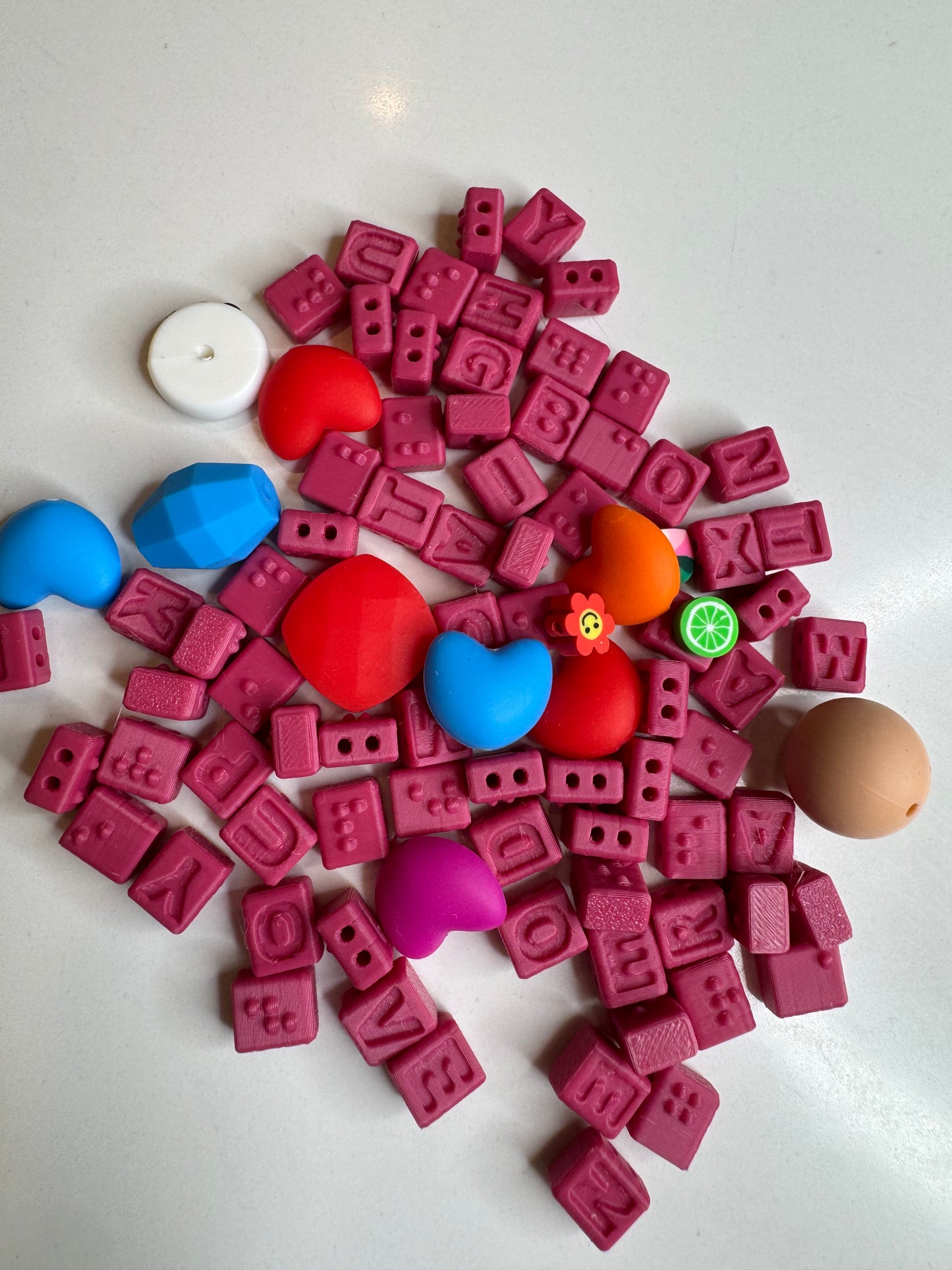 PINK BRAILLE BEADS