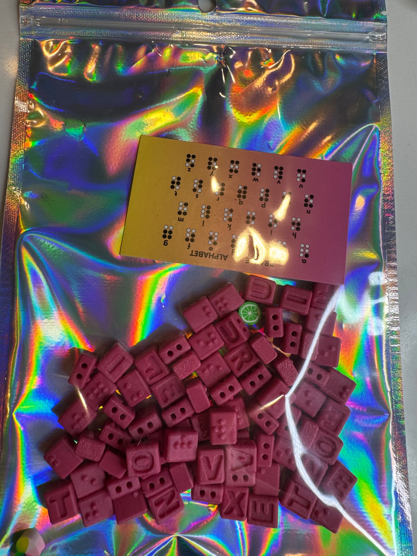 PINK BRAILLE BEADS