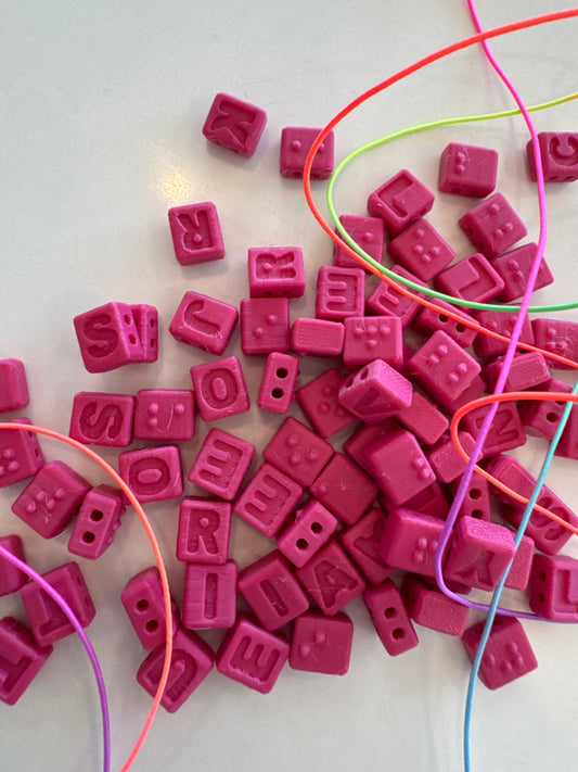 PINK BRAILLE BEADS